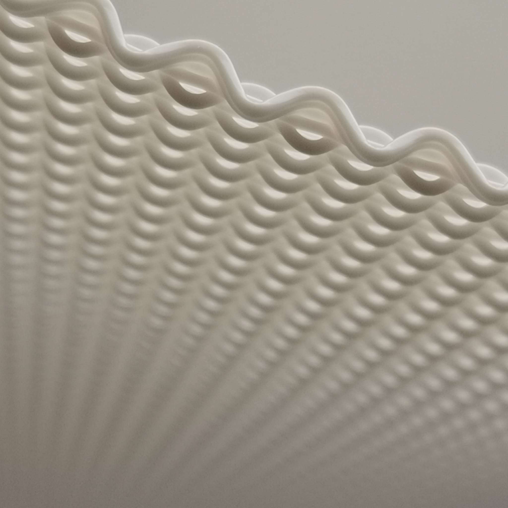 Close-up of textured white pendant lamp with wavy edge