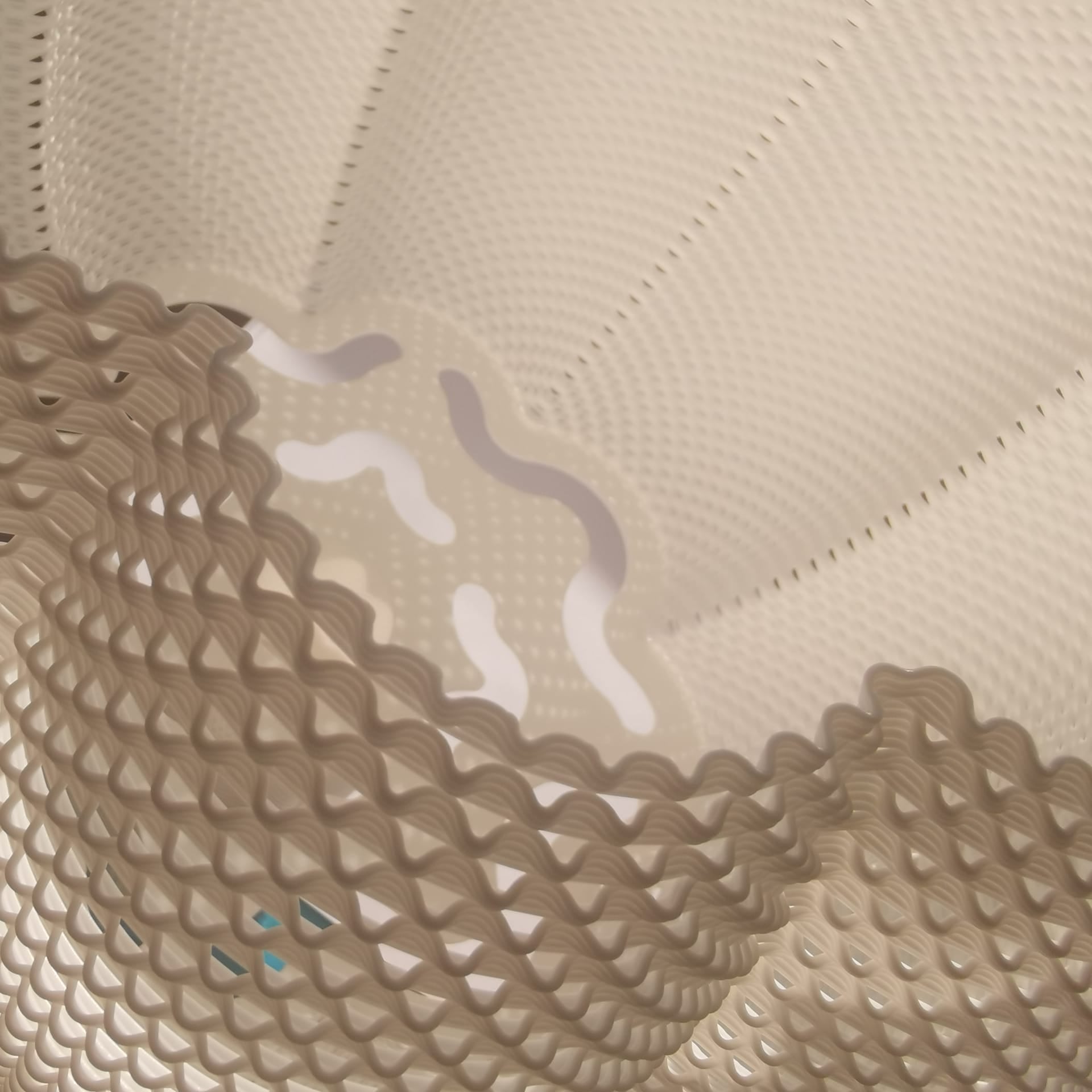 Close-up of textured beige fabric with wavy pattern