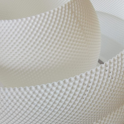 Close-up of a textured white pendant lamp surface