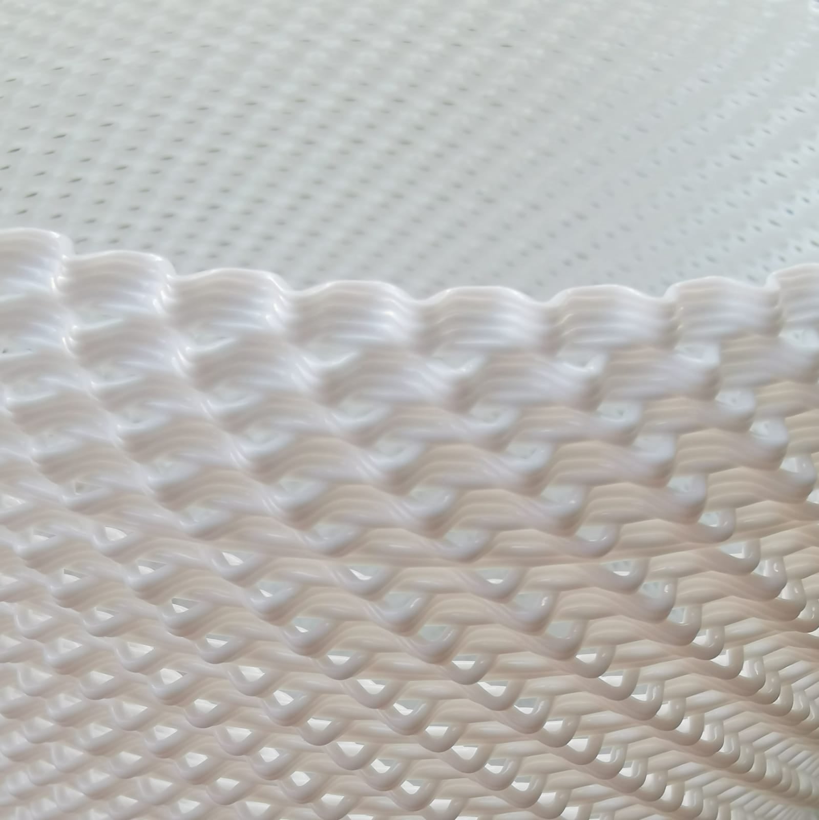 Close-up of white textured fabric on a light gray background