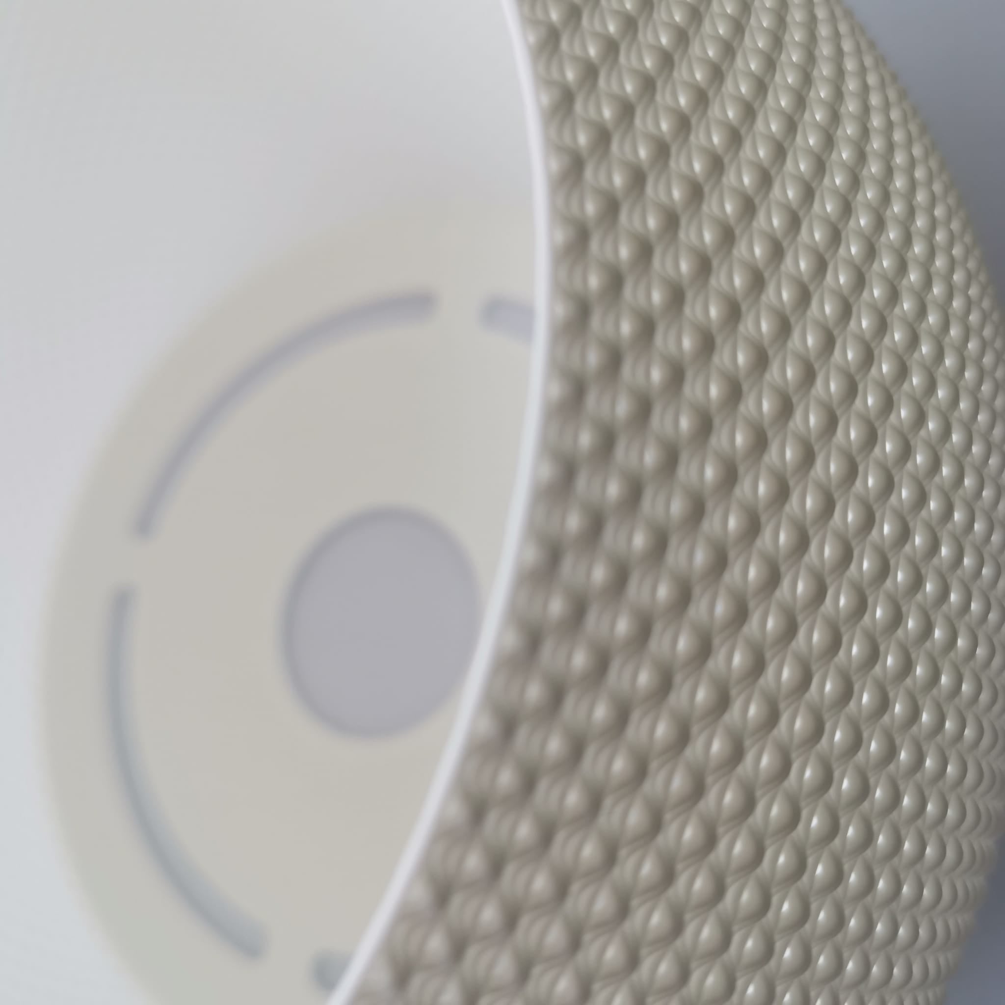 Close-up of textured beige ribbon on a blurred background