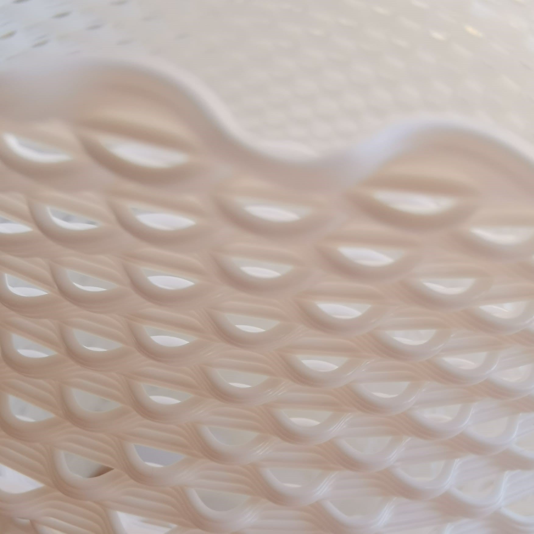 Close-up of a textured beige surface with wavy pattern