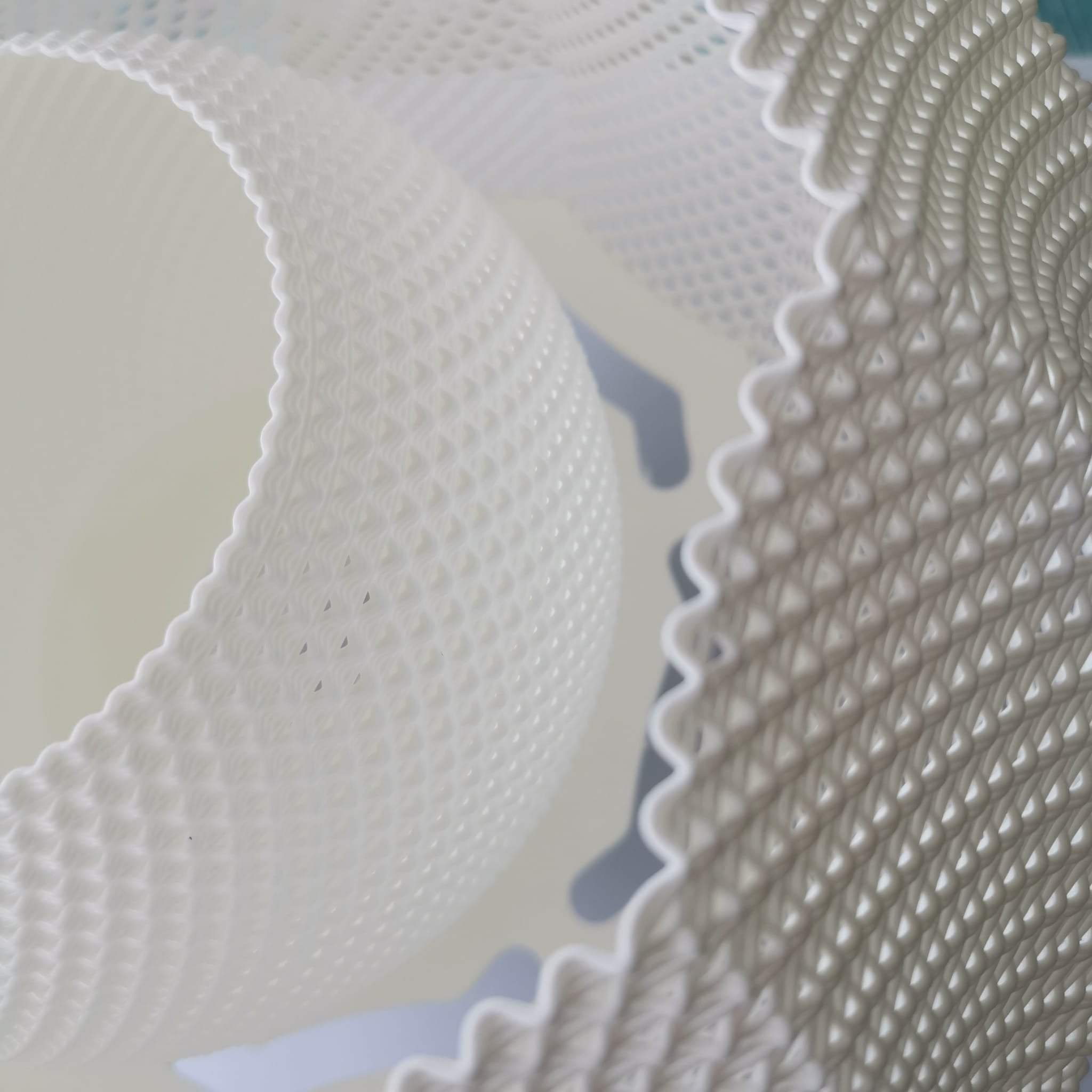 Macro close-up of the pendant lamp’s detailed woven texture and layered material design.