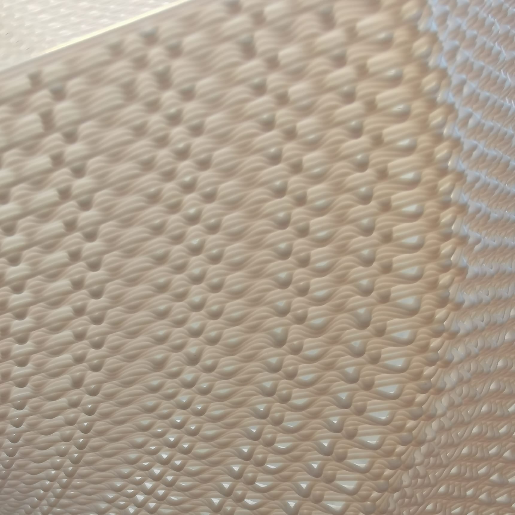 Close-up of a textured white surface with a subtle pattern