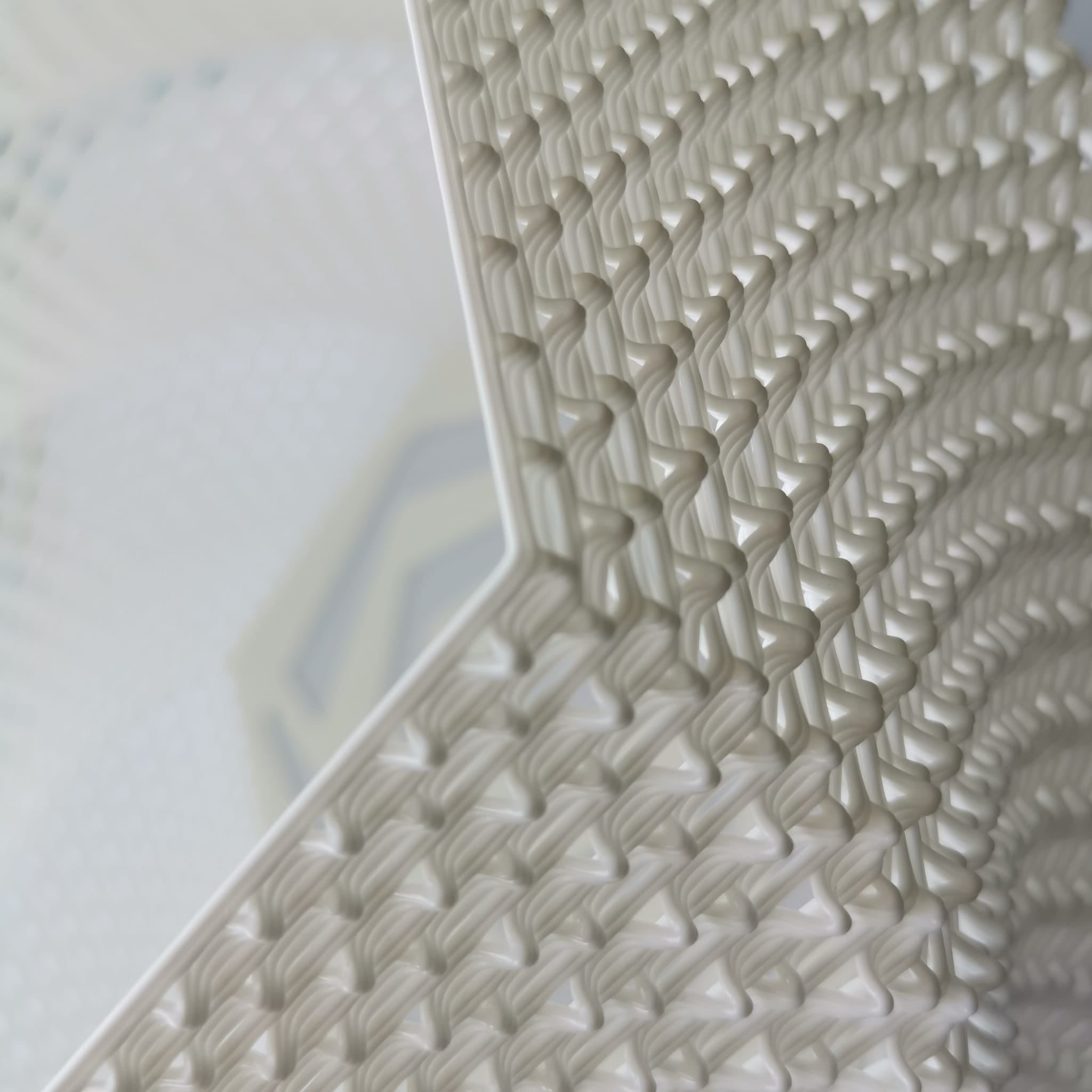Close-up of a textured white surface with geometric pattern