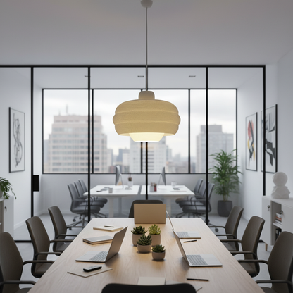 Modern pendant light centered above a contemporary office meeting table with glass walls